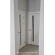 Фото установленных дверей Делла Новый Стиль белый матовый с черным стеклом в помещении